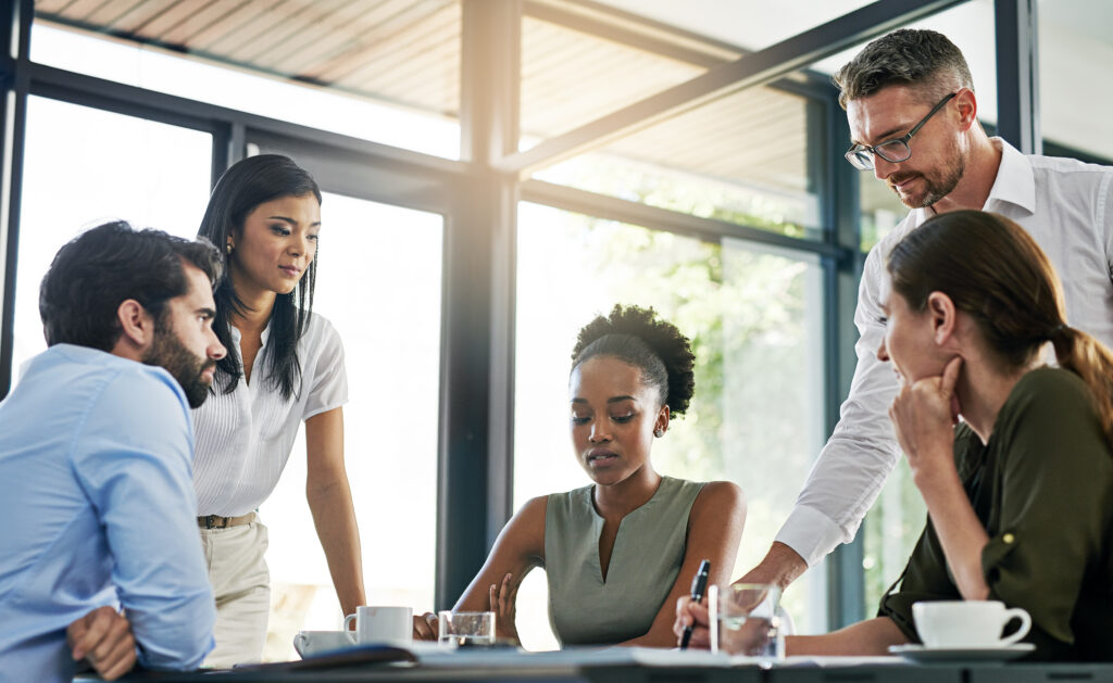 Shot of a group of colleagues working together in an office.