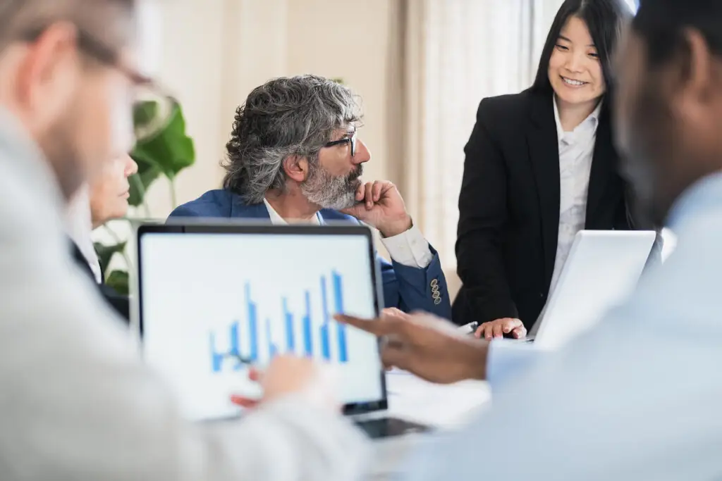 Multiracial business people working on financial markets in mode